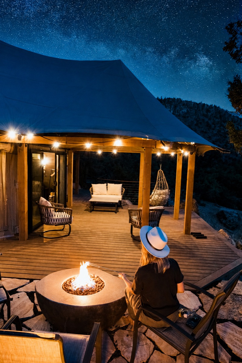 Luxury glamping deck lit at night near Zion National Park